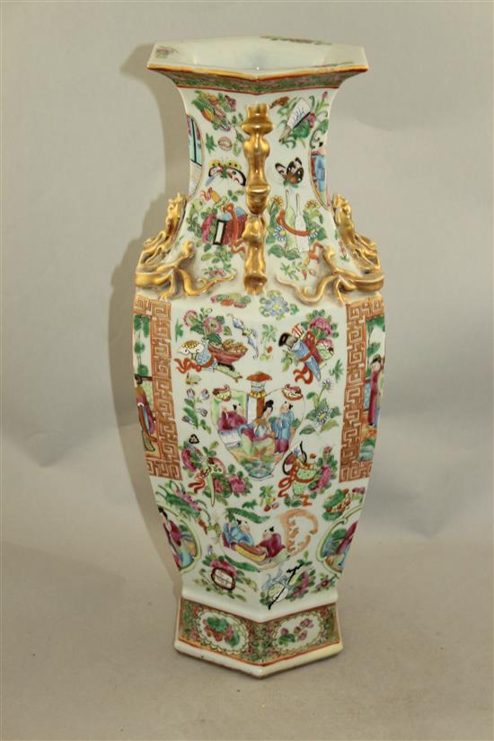 A Chinese Canton-decorated famille rose hexagonal baluster vase, mid 19th century, 44cm, slight restorations